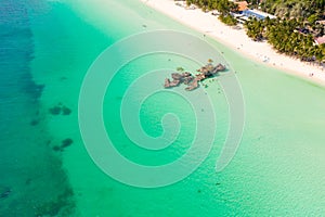 White sand beach and lagoon with turquoise water, aerial view. Boracay island Grotto, Willy`s Rock.