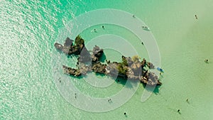 White sand beach and lagoon with turquoise water, aerial view. Boracay island Grotto, Willy`s Rock.