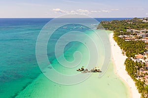 White sand beach and lagoon with turquoise water, aerial view. Boracay island Grotto, Willy`s Rock.