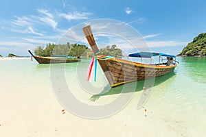 White sand beach and Long-tail boat at Kham-Tok Island koh-kam-tok, The beautiful sea Ranong Province, Thailand