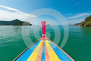 White sand beach and Long-tail boat at Kham-Tok Island koh-kam-tok, The beautiful sea Ranong Province, Thailand