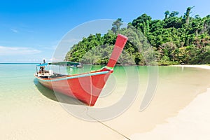 White sand beach and Long-tail boat at Kham-Tok Island koh-kam-tok, The beautiful sea Ranong Province, Thailand