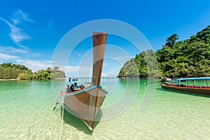 White sand beach and Long-tail boat at Kham-Tok Island koh-kam-tok, The beautiful sea Ranong Province, Thailand