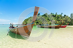 White sand beach and Long-tail boat at Kham-Tok Island koh-kam-tok, The beautiful sea Ranong Province, Thailand