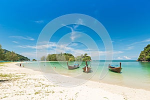 White sand beach and Long-tail boat at Kham-Tok Island koh-kam-tok, The beautiful sea Ranong Province, Thailand