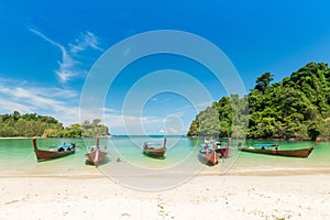 White sand beach and Long-tail boat at Kham-Tok Island koh-kam-tok, The beautiful sea Ranong Province, Thailand