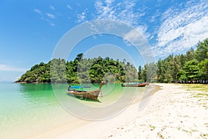 White sand beach and Long-tail boat at Kham-Tok Island koh-kam-tok, The beautiful sea Ranong Province, Thailand