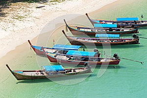White sand beach and Long-tail boat at Kham-Tok Island koh-kam-tok, The beautiful sea Ranong Province, Thailand