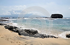 White sand beach with rocks