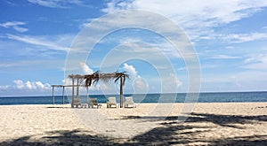 White sand beach with shacks and loungers