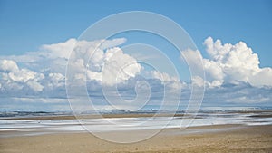 White sand beach time-lapse with fast moving cloud formations