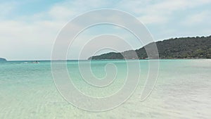 White sand beach and turquoise water, Koh Rong Samloem, Colombia. Aerial forward