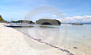 White sand beachfront of olango island
