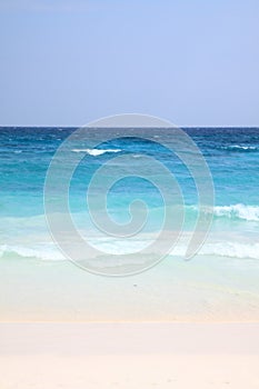 White sand with blue sea and sky