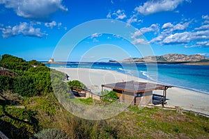 White sand and blue water in La Pelosa beach in Stintino