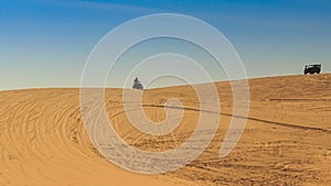 White Sand Dune Distant Quad Runs Jeep on Skyline