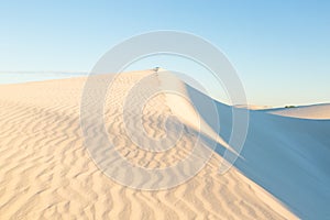 White sand dunes against blue cloudless sky, Jurien Bay