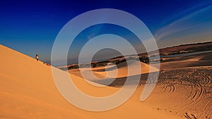 White Sand Dunes with Distant People Jeeps Quads