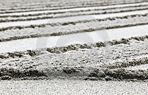 White sand in a a Japanese Zen Buddhism garden