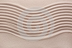 White sand with pattern as background, top view. Concept of zen and harmony