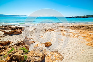 White sand and rocks in Le Bombarde beach