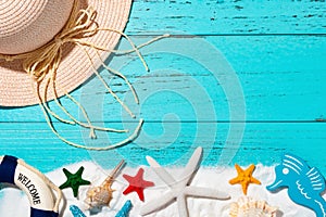 White sand and sea shells and starfishes and buoy and seahorse and cap as summer holidays concept