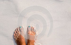 White sand texture woman feet. Relaxed tourist on beach. Tropical vacation banner template with text place
