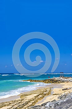 White sand, turquoise waters against the blue sky at Pandawa Beach, Bali, Indonesia.