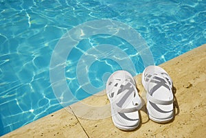 White sandals at the poolside