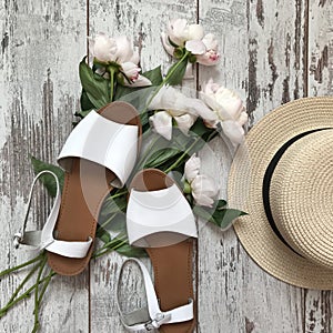 White sandals on a wooden background