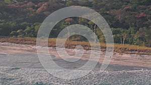 White sandy beach, Nosara, Guanacaste, Costa Rica. Aerial dr