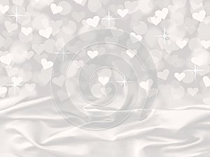 White satin and heart bokeh valentine's day card background with sparkles