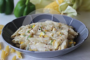 White sauce penne pasta with capsicum and sweet corn