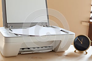 White scanner or printer machine on a table close up