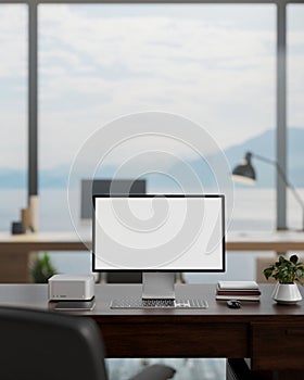 A white-screen computer mockup on a desk in a modern spacious office with a beautiful nature view