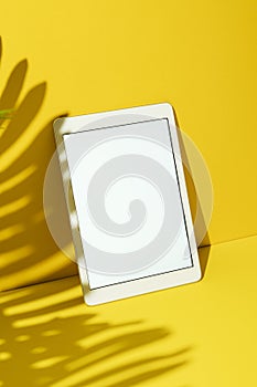 White screen digital tablet mockup on yellow background