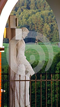 One of the stations of Way of the Cross located in GietrzwaÃâd sanctuary in Poland. photo