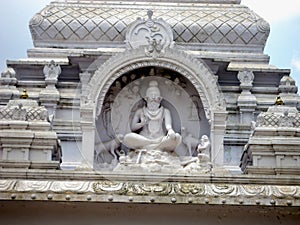 A white sculpture of Narayanappa, temple arch at Narayanappa Mutt in Kaivara, Karnataka, India.