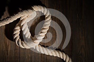 White sea rope on the wooden floor.