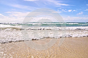 White sea waves. Blue sky