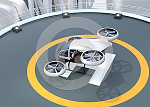 White self-driving passenger drone takeoff from helipad