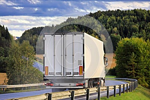 White Semi Trailer Transporter at Speed