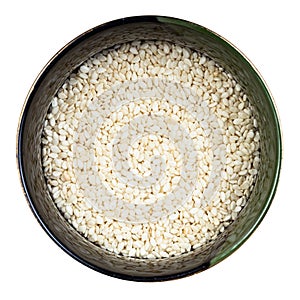 White sesame seeds in round bowl isolated
