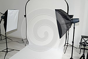 White setup photograph modern photo studio room with professional equipment