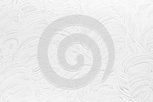 White shabby dry scratched paint texture with curly curved lines as modern abstract background.