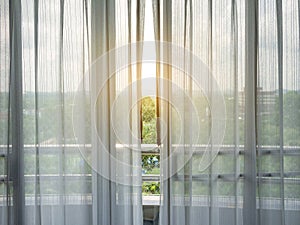 White sheer curtains and balcony