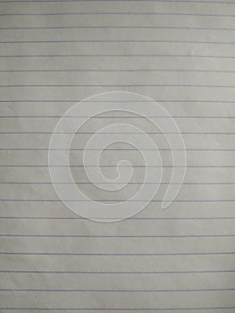 White sheet. A blank notebook sheet in a line. A lined sheet of paper. Writing paper. Vertical photo