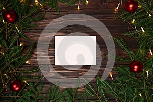 white sheet of paper in a Christmas wreath frame .