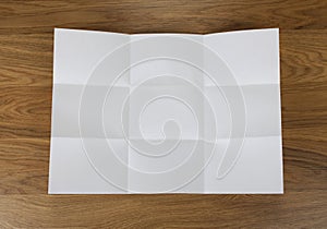 White sheet of paper folded in nine top shooting.