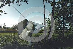 White sheets dry on a rope in nature